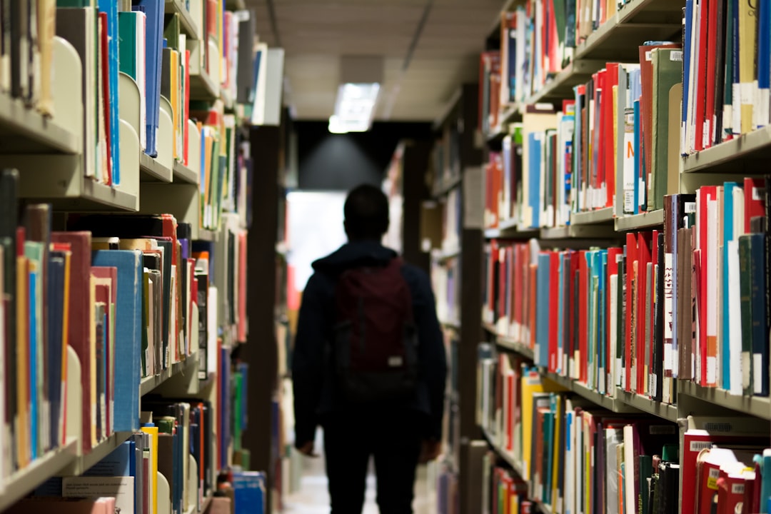 services-02 man-with-backpack-beside-a-books-9o8ydygtt64